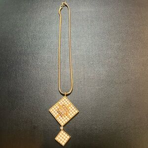 Vintage (70s) 24” gold tone snake chain and pendant